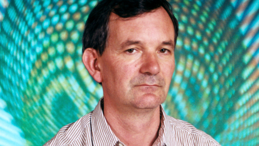 headshot of martin parr against blue background