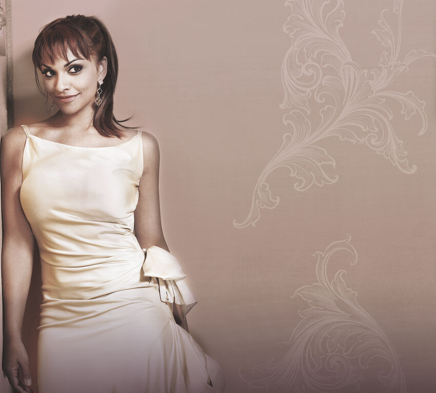 Danielle de Niese in a silky cream dress