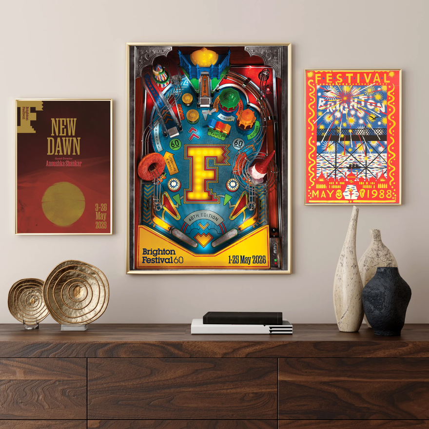 Three Brighton Festival posters on a wall