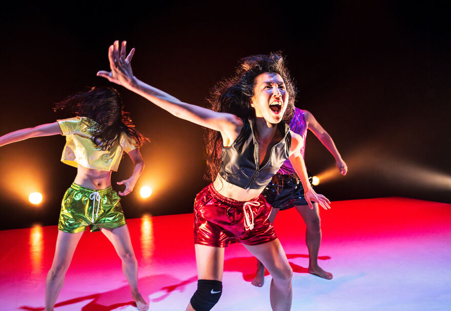 Picture of three performers dancing on stage at Tomorrowisnowtodayisyesterday