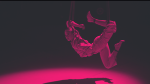 A woman suspended from ropes