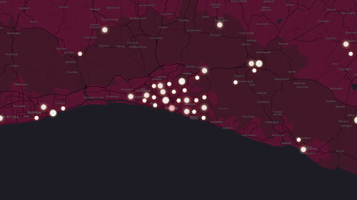 A map of Brighton and hove is lit up by many luminous dots