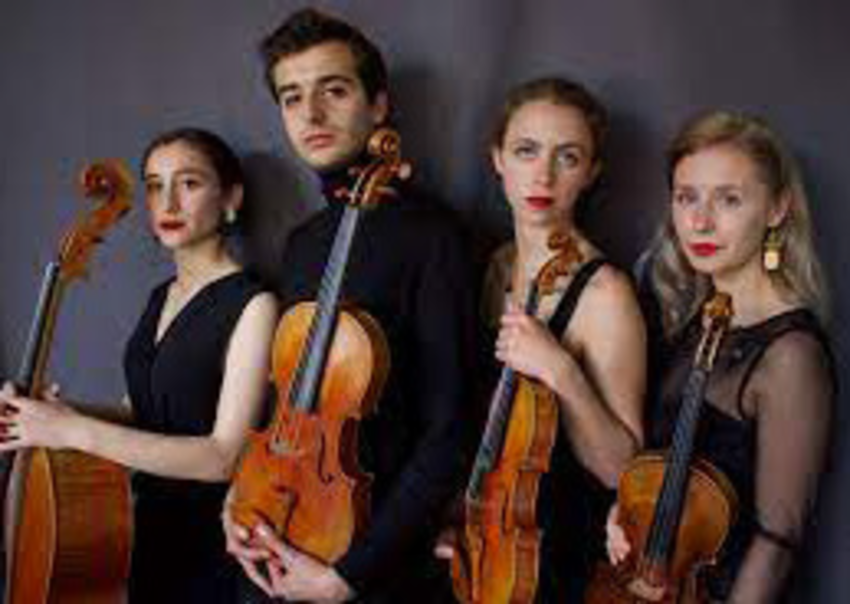 Echea Quartet wearing all black, standing in a line holding their instruments - a cello, viola, and violins