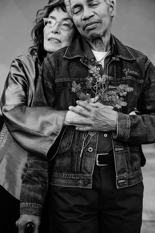 Beverly Glenn Copeland is embraced from behind by his wife Elizabeth Copeland