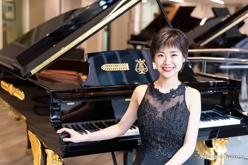 A woman sitting at a piano