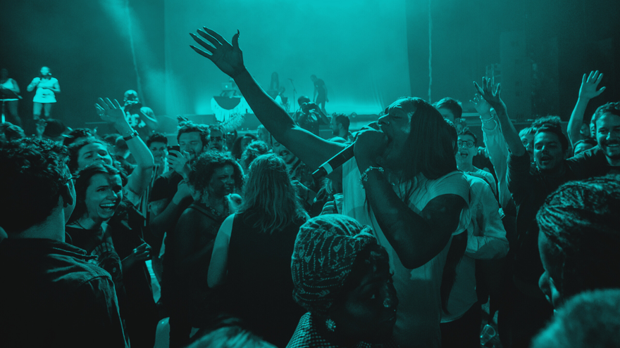 Big Freedia performs amongst a crowd of people