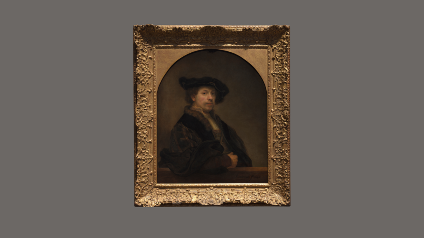 A painting of Rembrandt in an extravagant gold frame. In the painting Rembrandt is sat with his arms folded. He wears a black hat and a black robe.