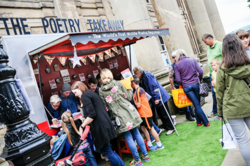A market stall with people gathered outside