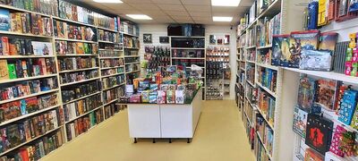 The outside entrance of Dice Saloon, a dark blue building with white entranceway and Dice Saloon written above