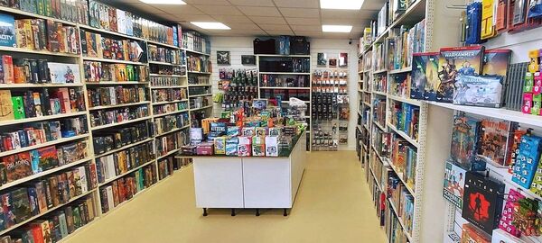 The outside entrance of Dice Saloon, a dark blue building with white entranceway and Dice Saloon written above