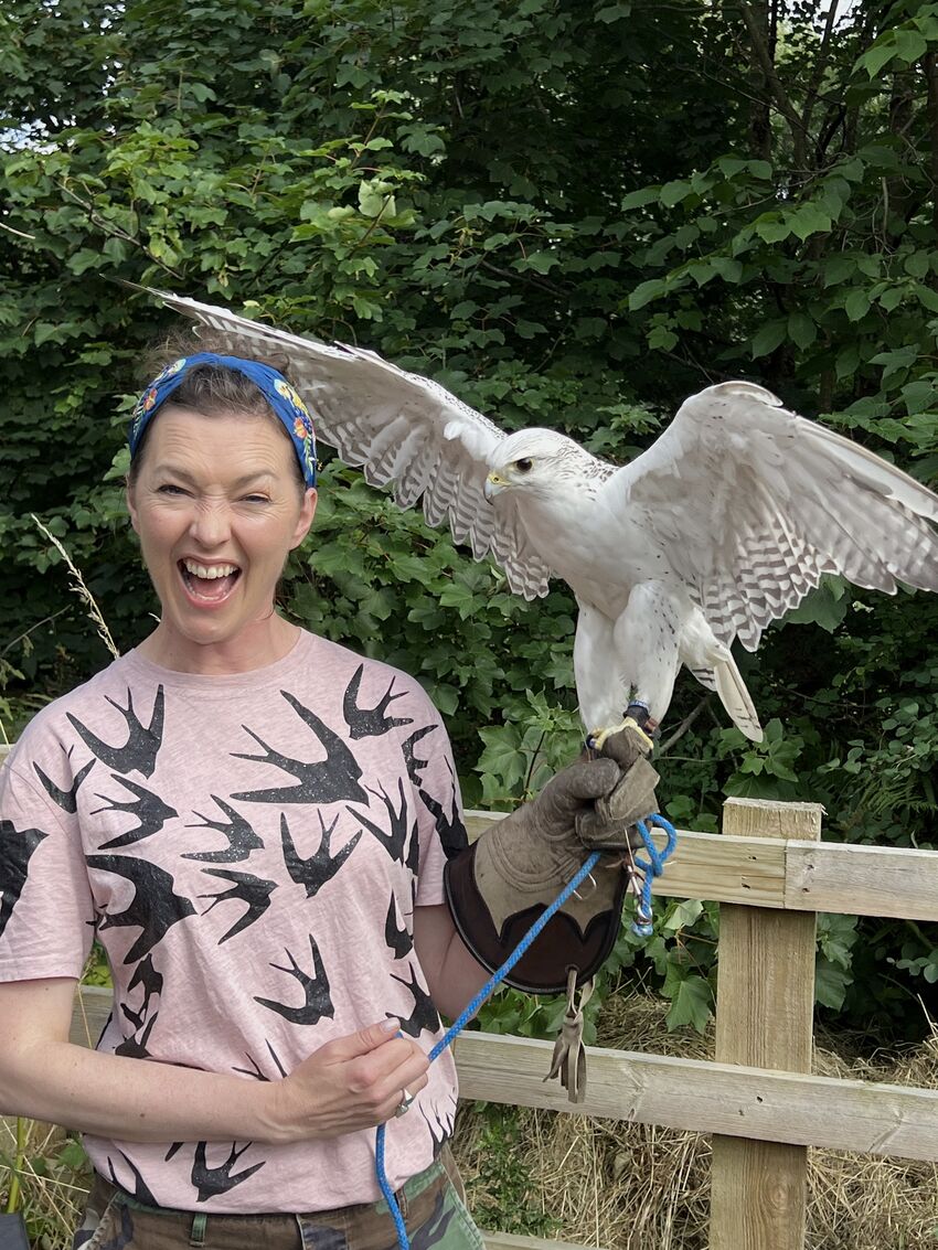 MG Leonard smiles with glee holding a Gyrfalcon