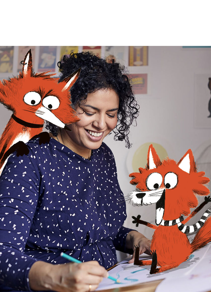Nadia Shireen smiles as she colours her drawing, with two cartoon foxes joining in having fun