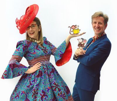 Philip Reeve and Sarah McIntyre smiling in colourful clothes holding illustrated mice