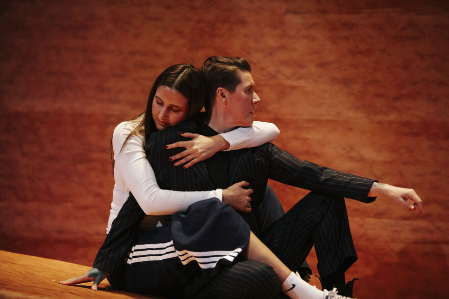 A picture of Tink & Abra Flaherty hugging on stage