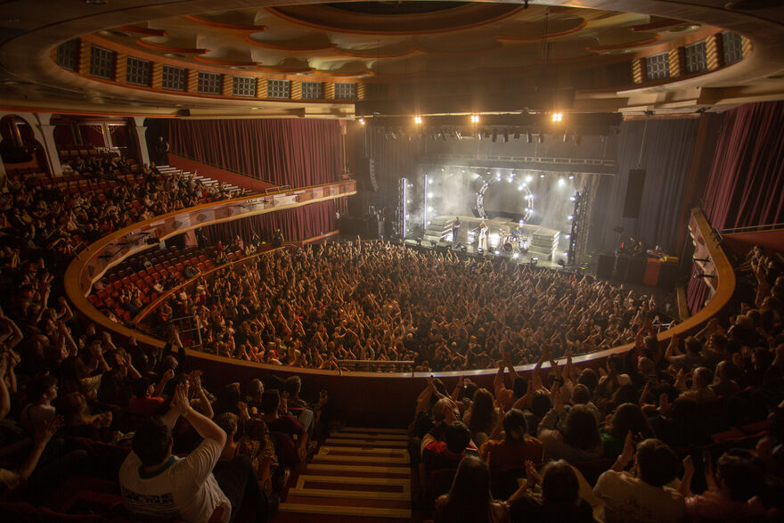 Rina Sawayama performs on stage to a full Brighton Dome