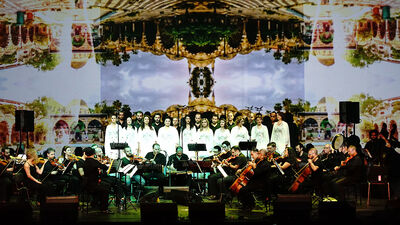 The Orchestra of Syrian Musicians performing on stage