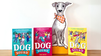 Clara Vulliamy books 'The Dog Squad' series next to an cardboard cut out of a dog