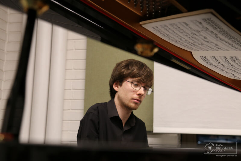 Dominic Degavino playing a grand piano