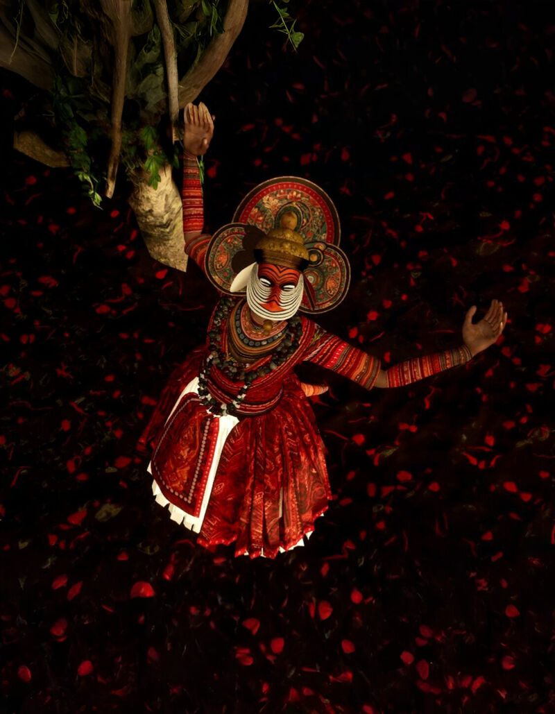 A dancer shot from above standing on a carpet of petals