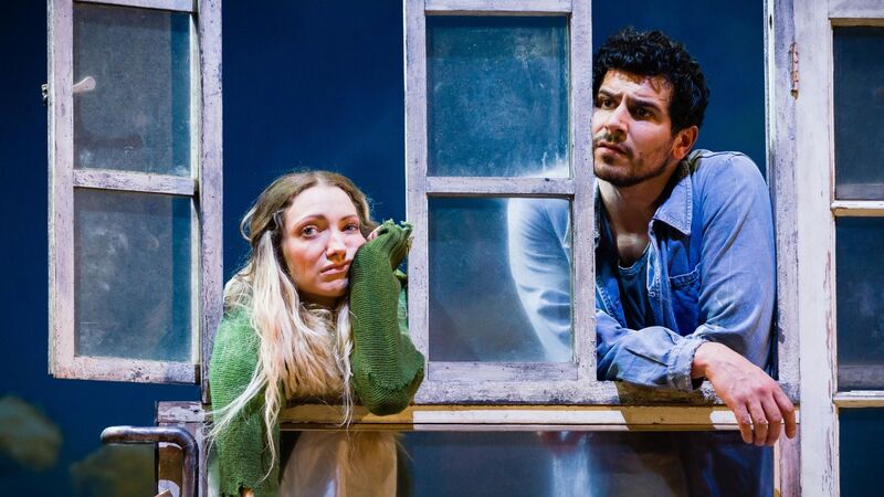 Cathy and Heathcliff look out through windows