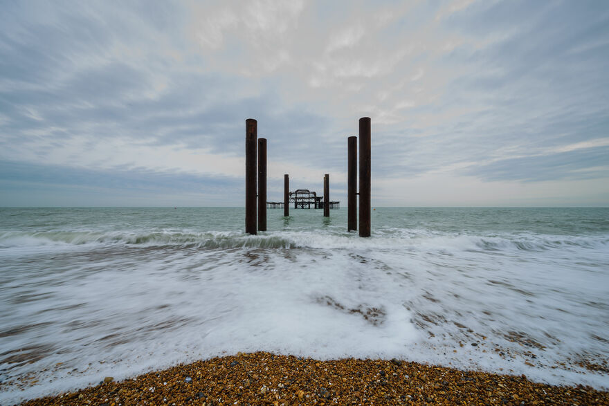 Pebbles, water and the west pier