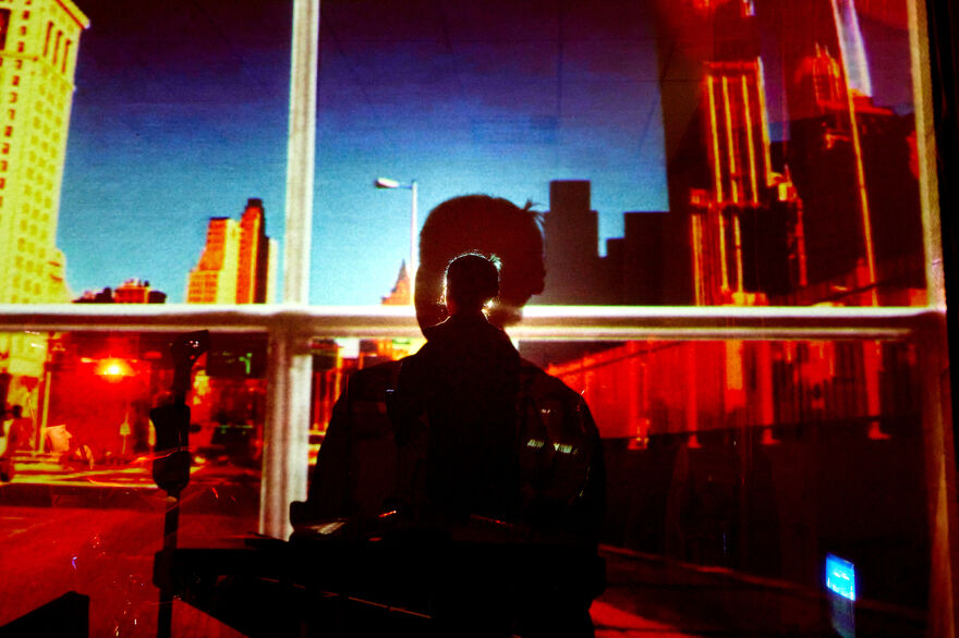 Picture of a silhouette against a cityscape
