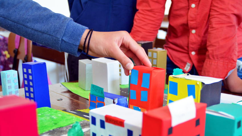 An image of a city made out of paper houses